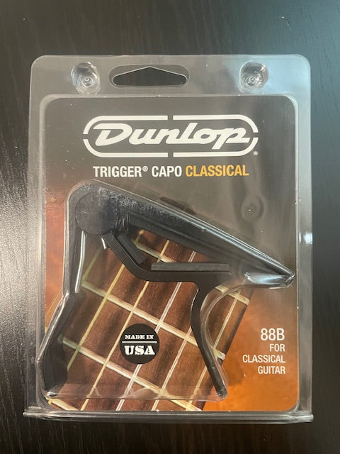 Capodastre Trigger 88B à pince, plat, pour guitare classique, noir Dunlop-3000 partitions, livres et vinyles d'occasion en vente sur notre site internet gastonmusicclub.fr Gaston Music Store